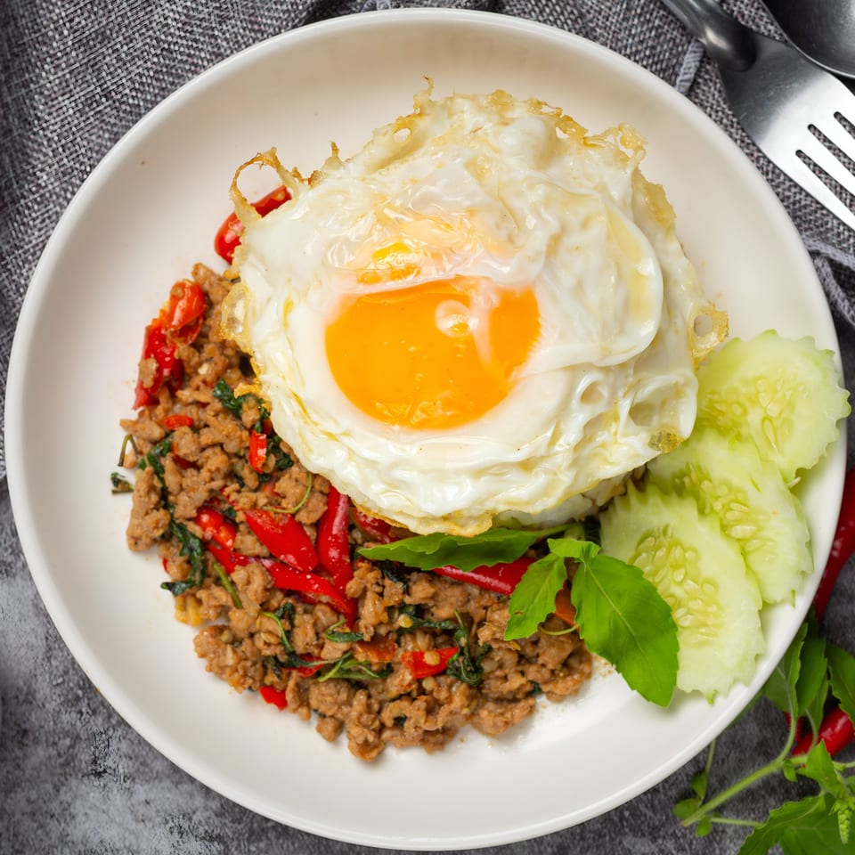 Kati Thai Eatery's Pad Krapow with minced pork, chili, basil, and a fried egg.